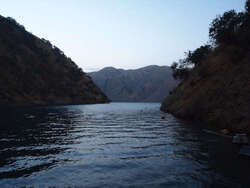 Photo of a lake with mountains in the background